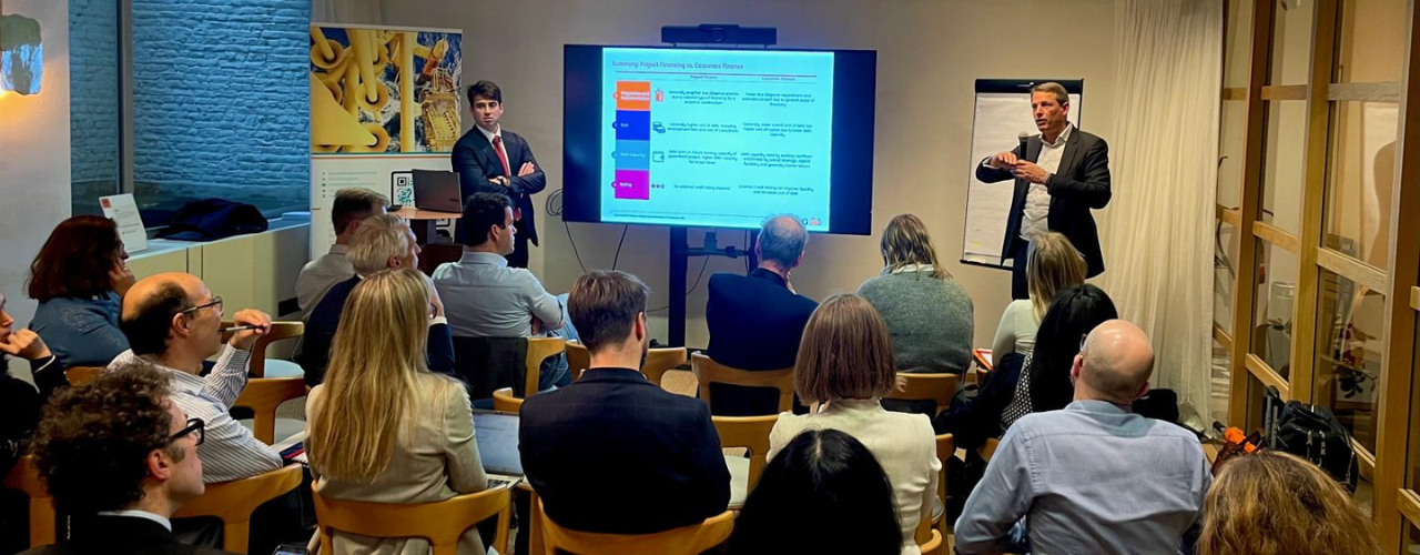 ZEP–ING workshop on financing carbon capture and storage (CCS) in Brussels: a presenter speaks to about 30 attendees while a slide on financing models is displayed.